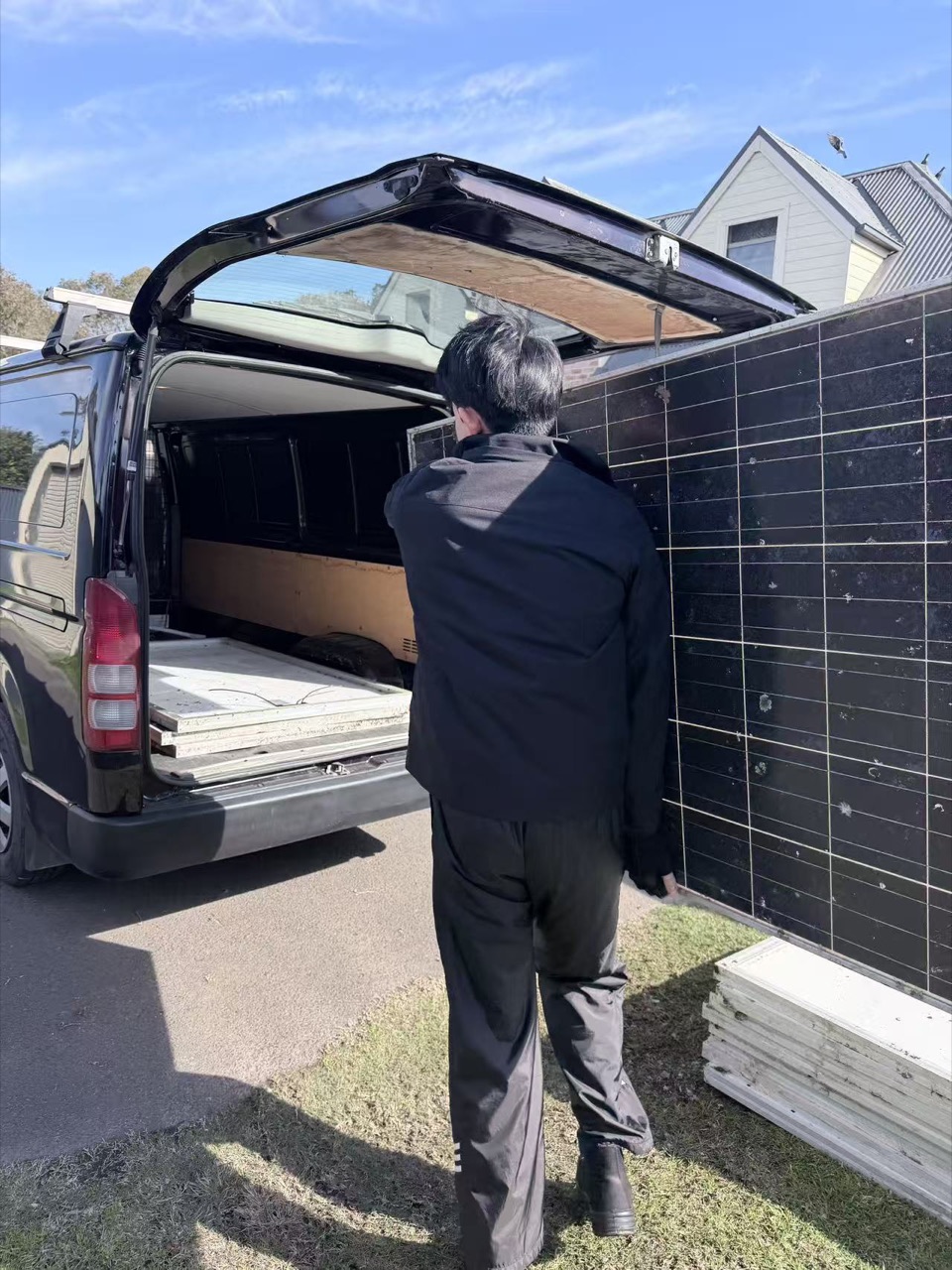 Stacked used solar panels entering the recycling recovery process