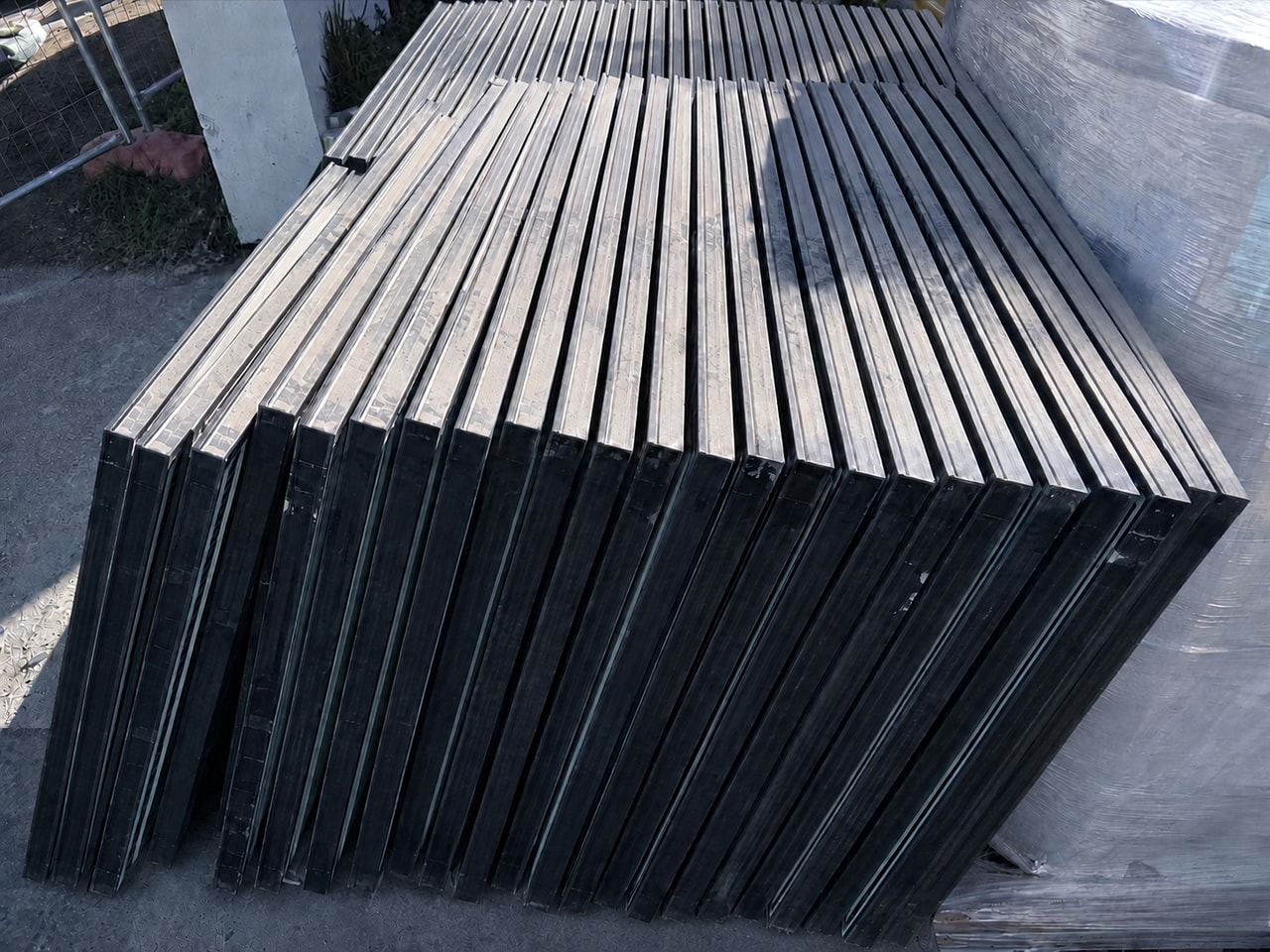 Stacked solar panels with a ReSova collection docket on top after an on-site count in Sydney